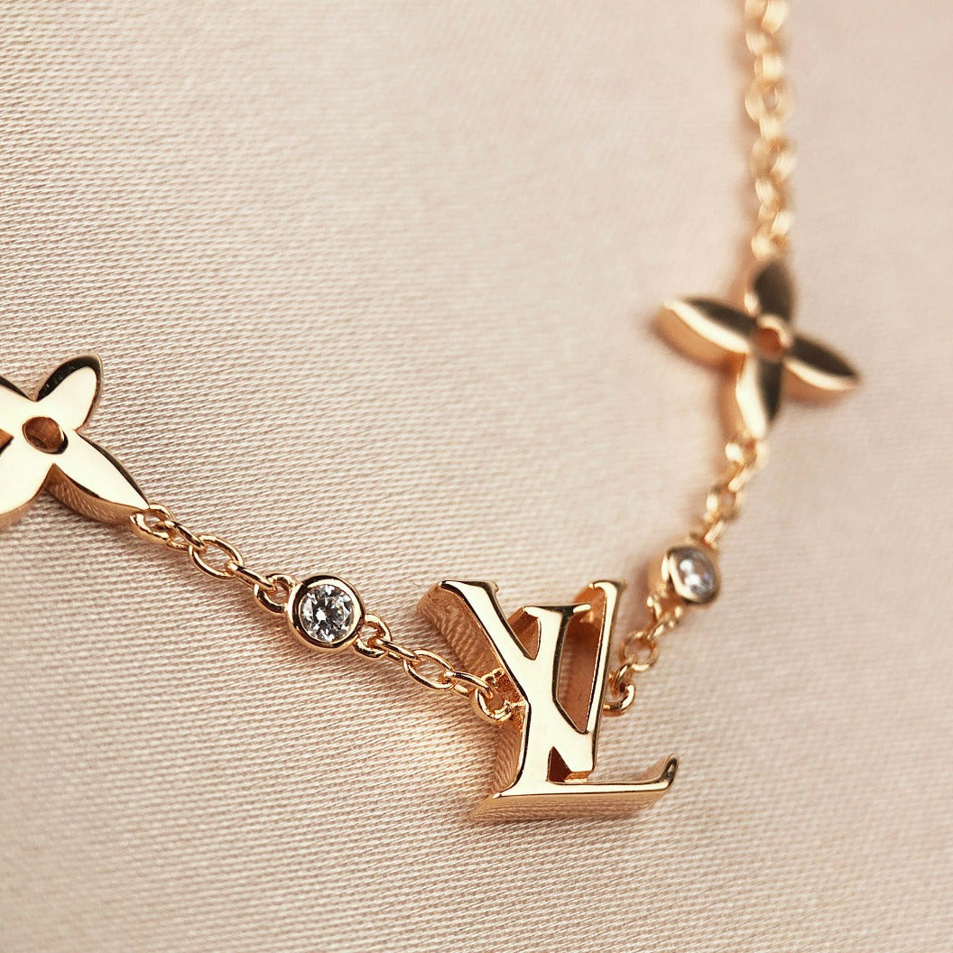 [BIJOUX]BRACELET EN OR 7 MOTIFS ÉTOILE ET SOLEIL