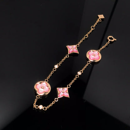 [BIJOUX]BRACELET OR ROSE NACRE ROSE 4 MOTIFS ÉTOILE ET SOLEIL