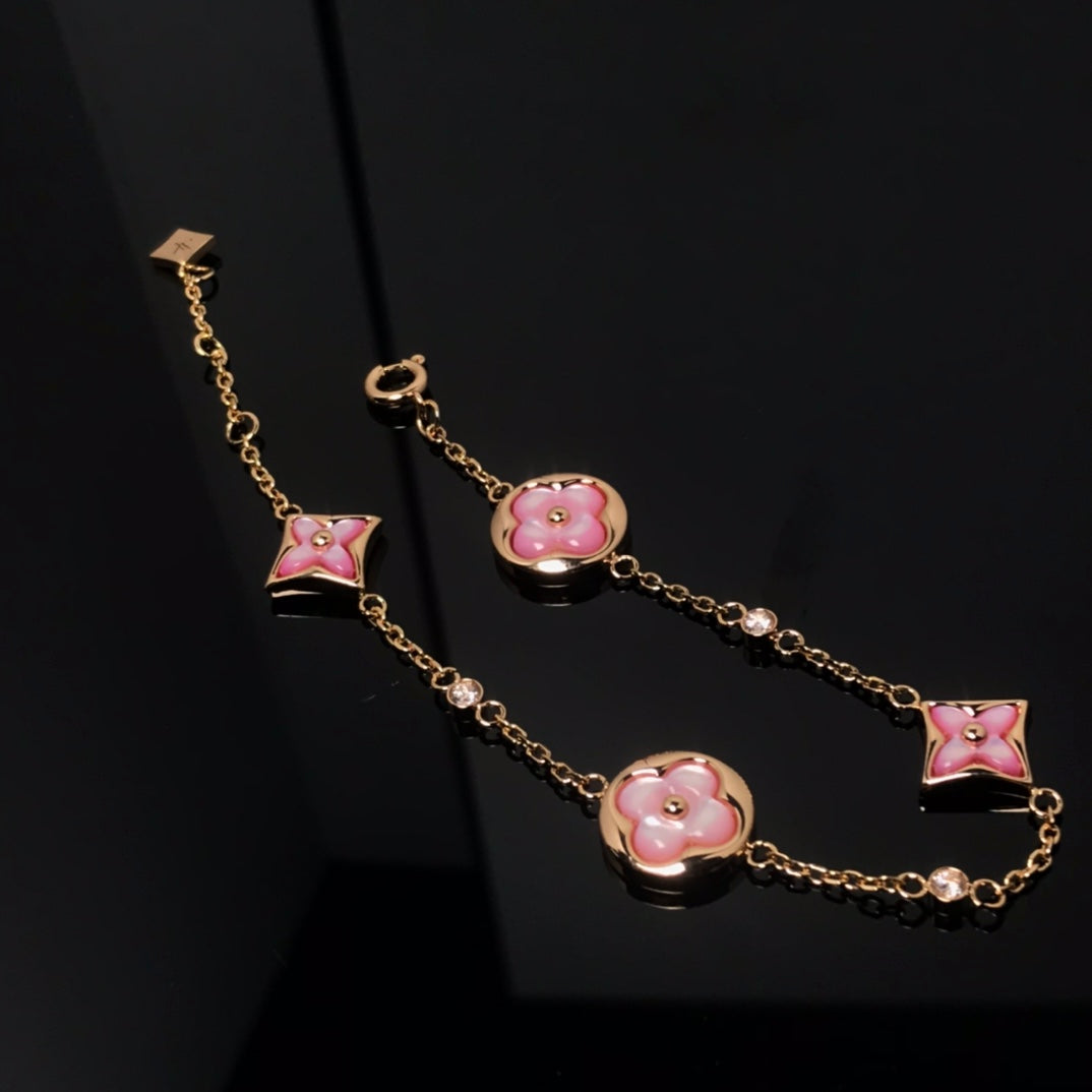 [BIJOUX]BRACELET OR ROSE NACRE ROSE 4 MOTIFS ÉTOILE ET SOLEIL