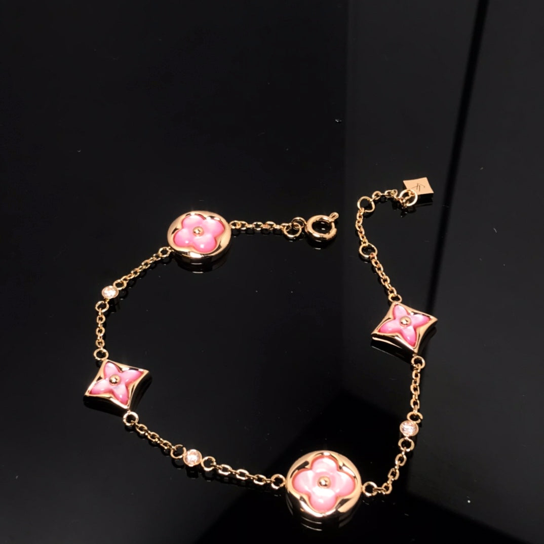 [BIJOUX]BRACELET OR ROSE NACRE ROSE 4 MOTIFS ÉTOILE ET SOLEIL
