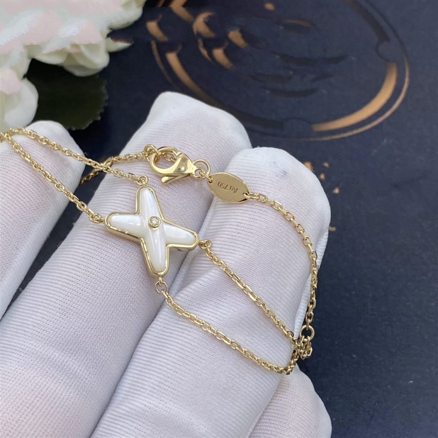 [BIJOUX]JEUX BRACELET NACRE BLANC OR 1 DIAMANT