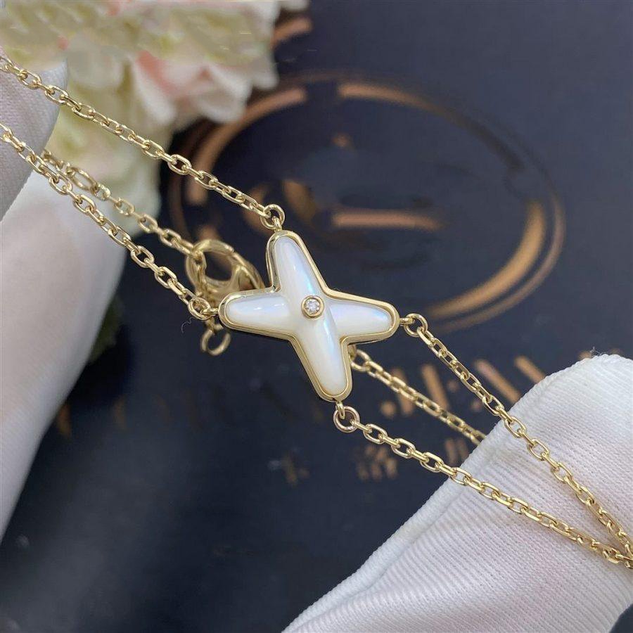 [BIJOUX]JEUX BRACELET NACRE BLANC OR 1 DIAMANT