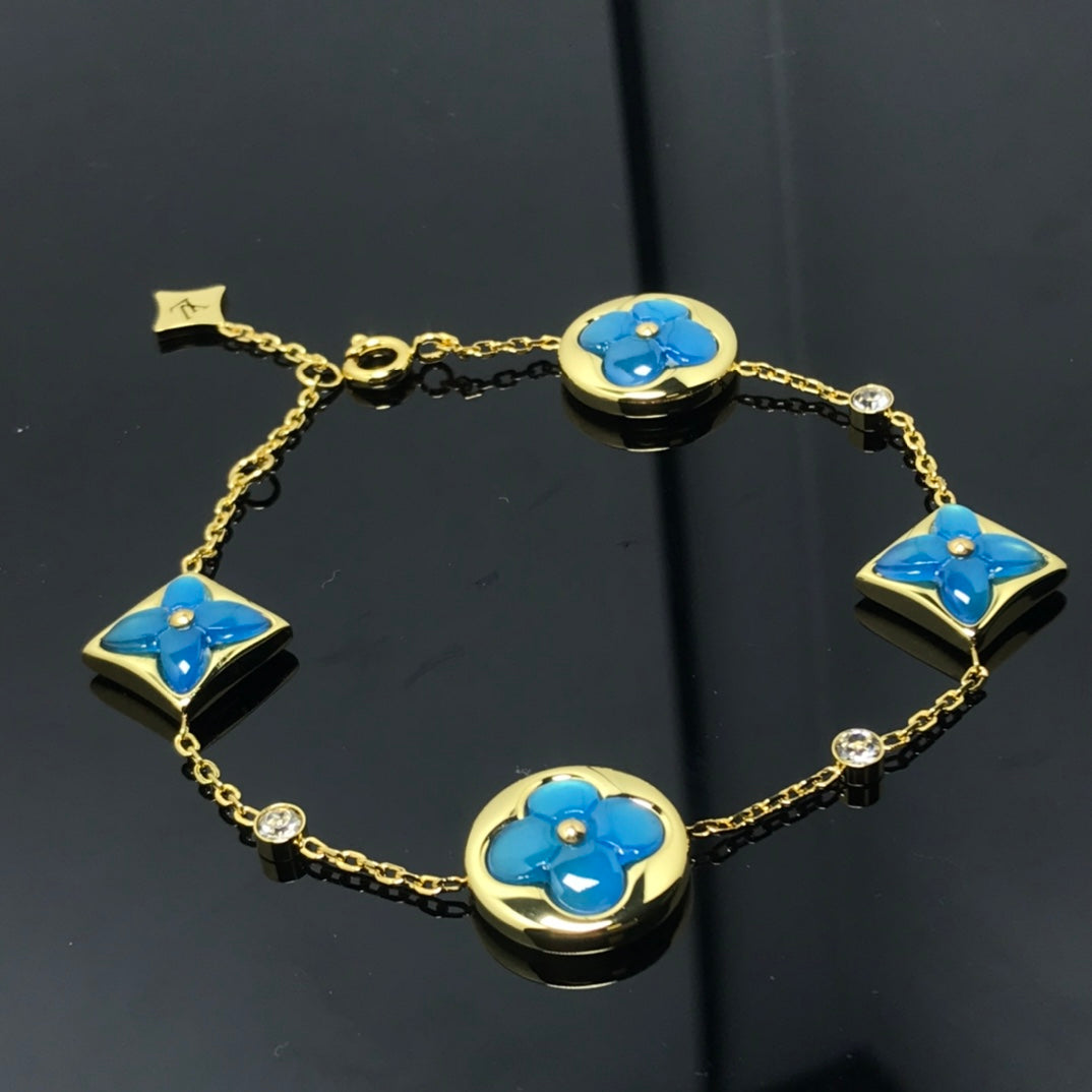 [BIJOUX]BRACELET 4 MOTIFS ÉTOILE ET SOLEIL BLEU